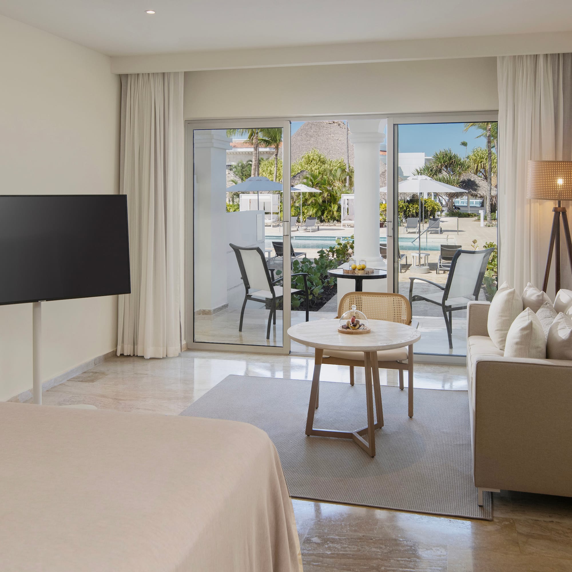 a room with a television and a bed