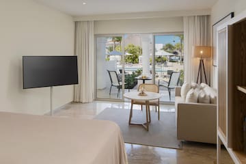 a room with a television and a bed