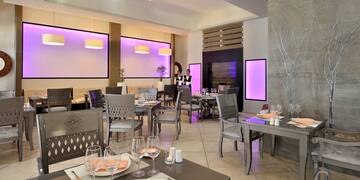 a restaurant with tables and chairs