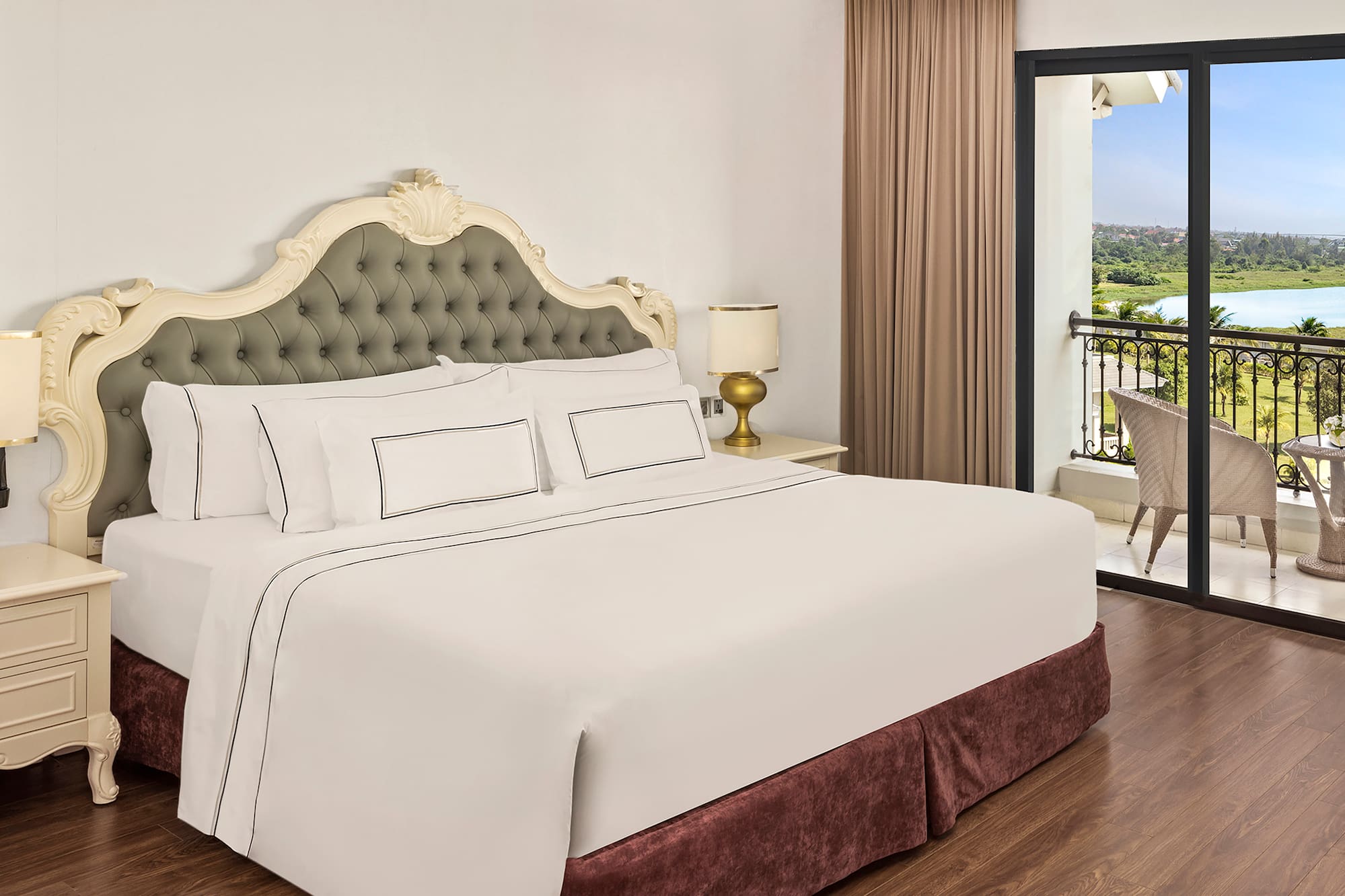 a bed with a glass door and a balcony