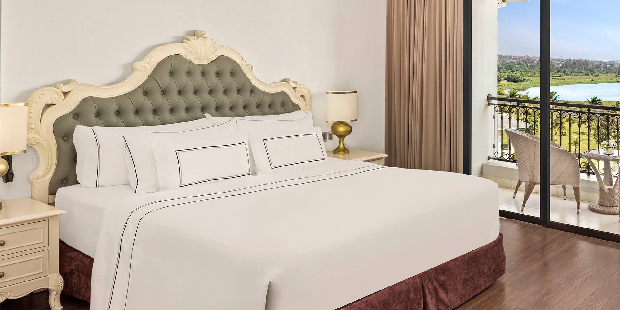 a bed with a glass door and a balcony