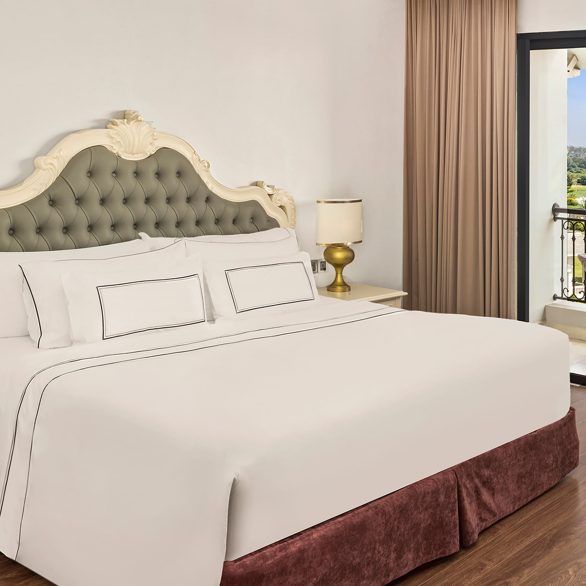 a bed with a glass door and a balcony