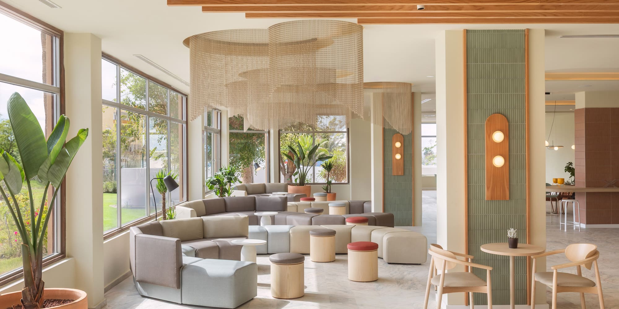 a room with a large window and a large table and chairs