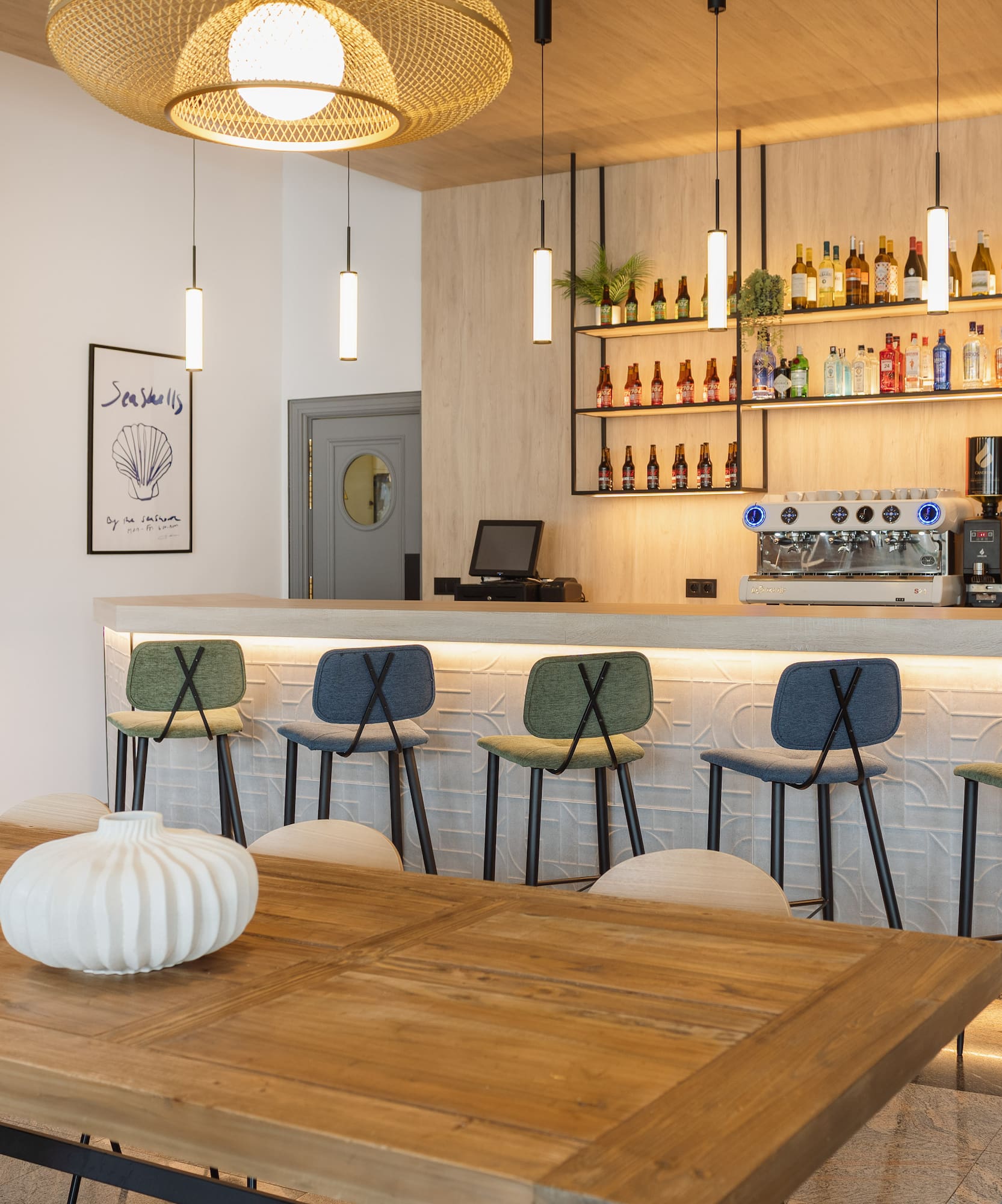 a bar with a table and chairs