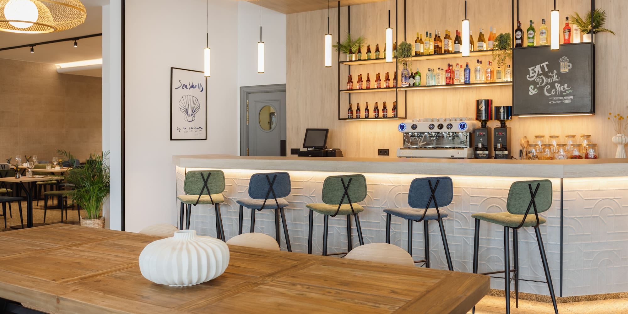 a bar with a table and chairs