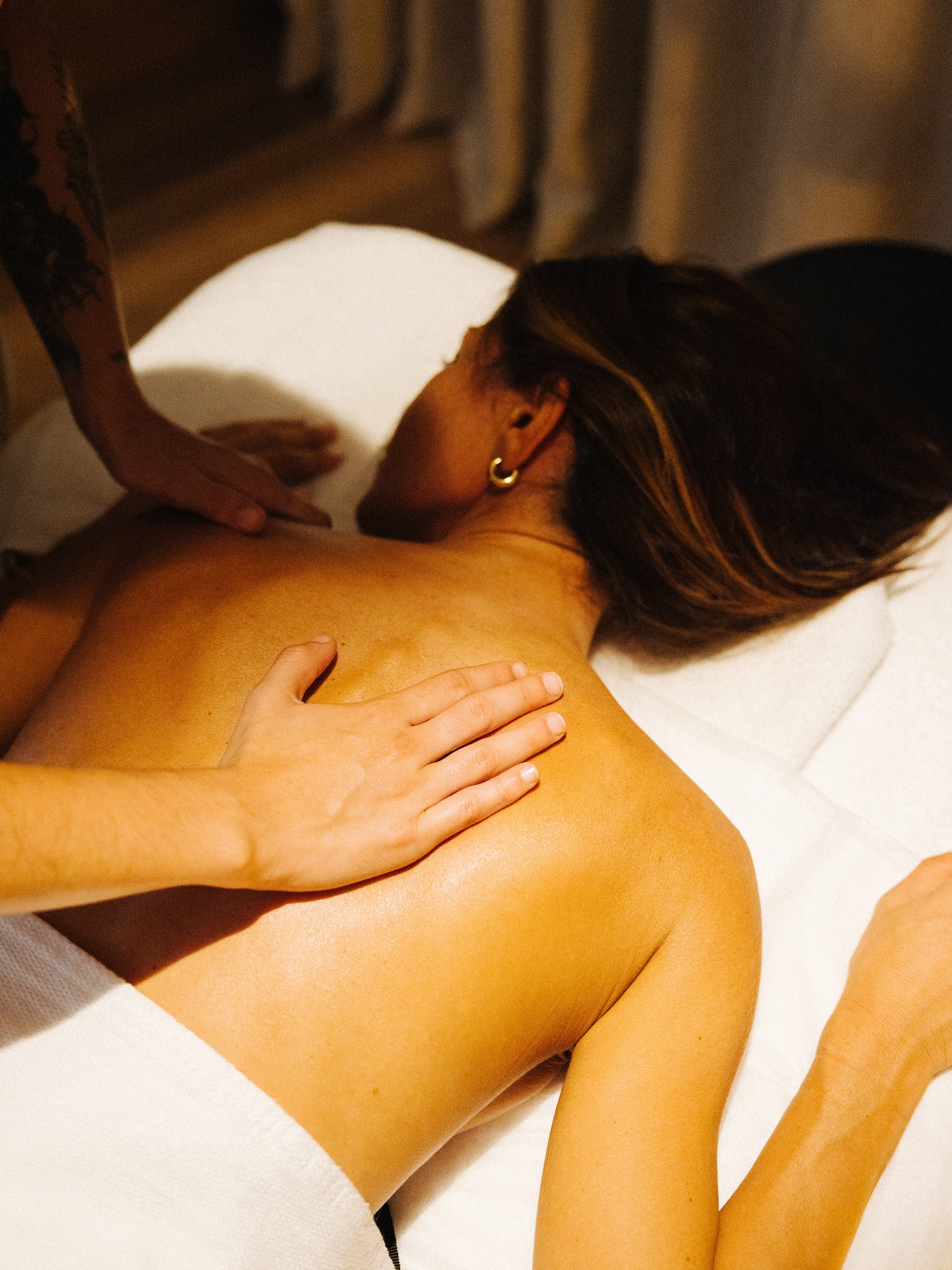 a woman lying down on a massage table