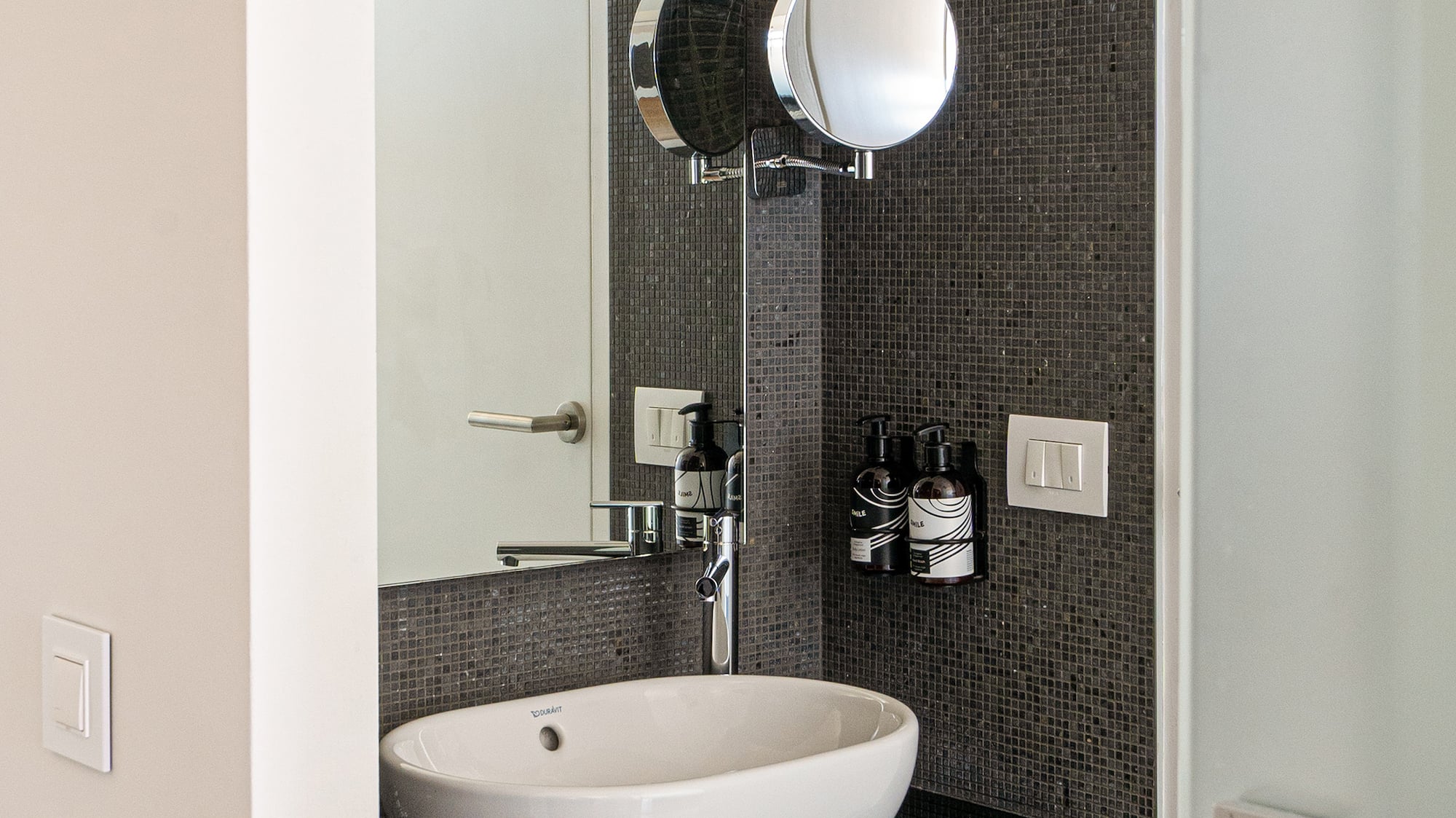 a sink and mirror in a bathroom