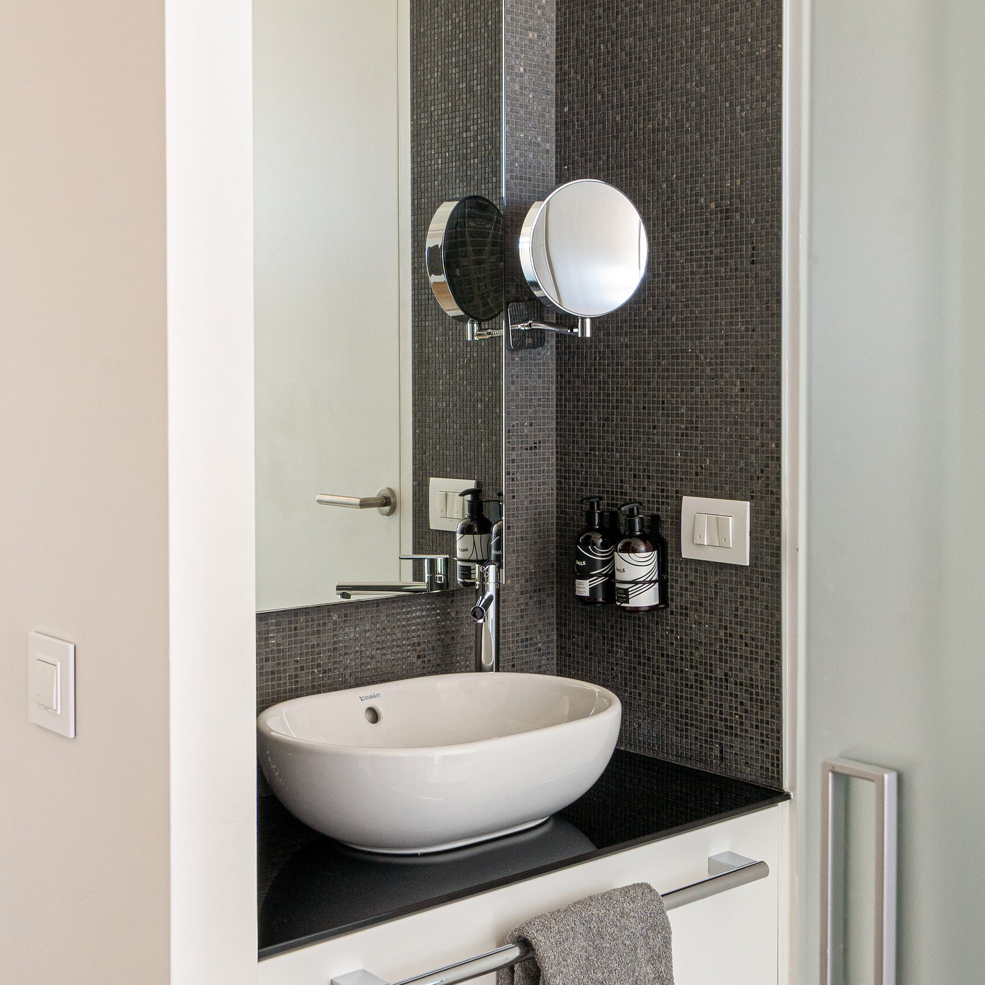 a sink and mirror in a bathroom