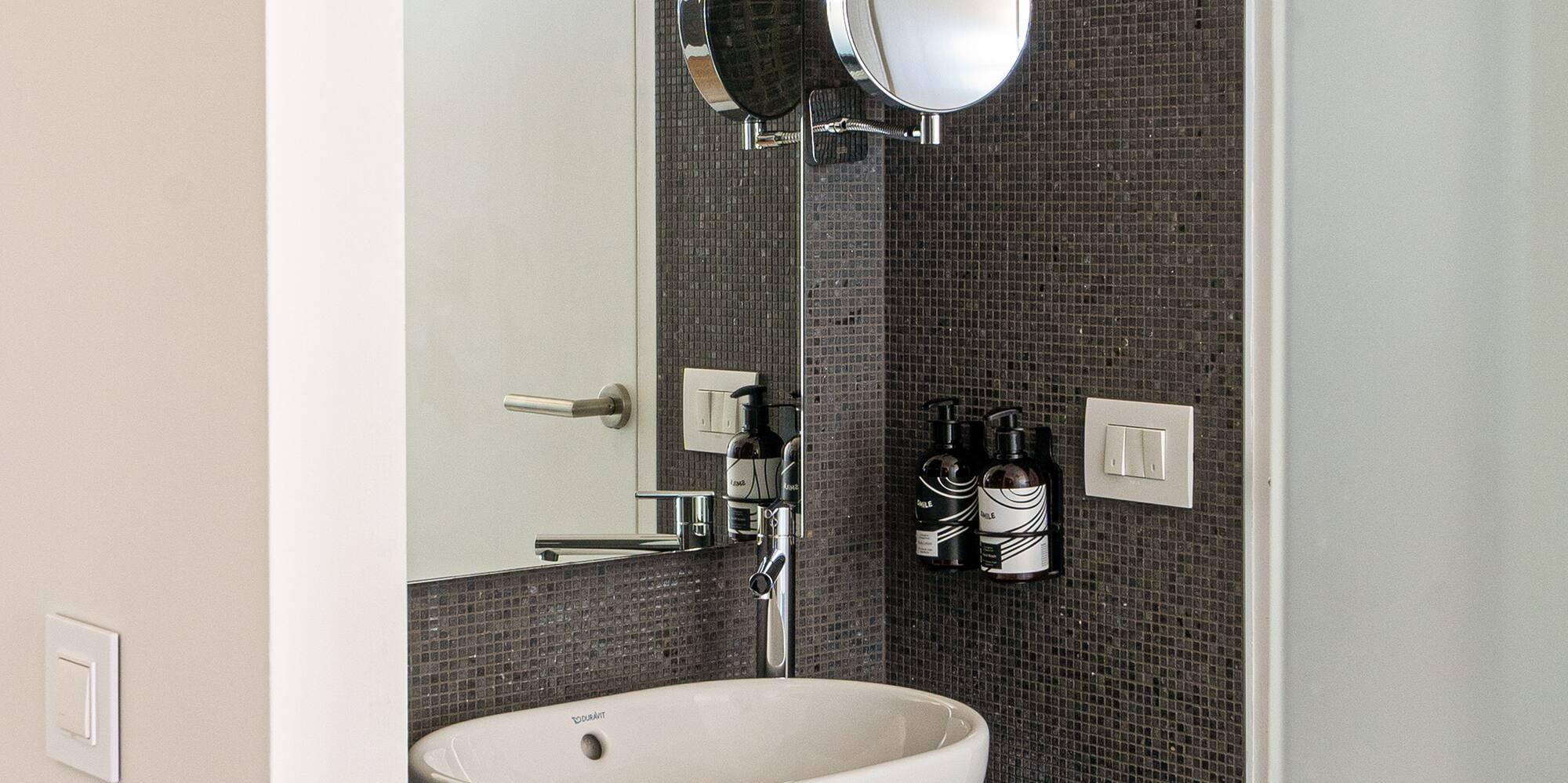 a sink and mirror in a bathroom