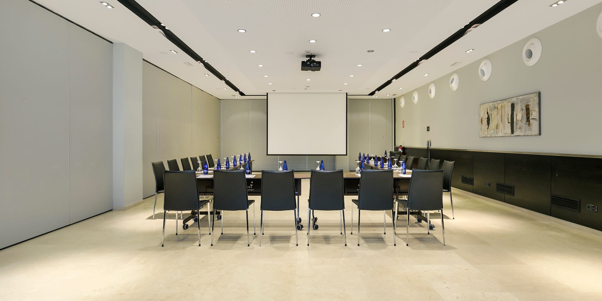 a conference room with a table and chairs