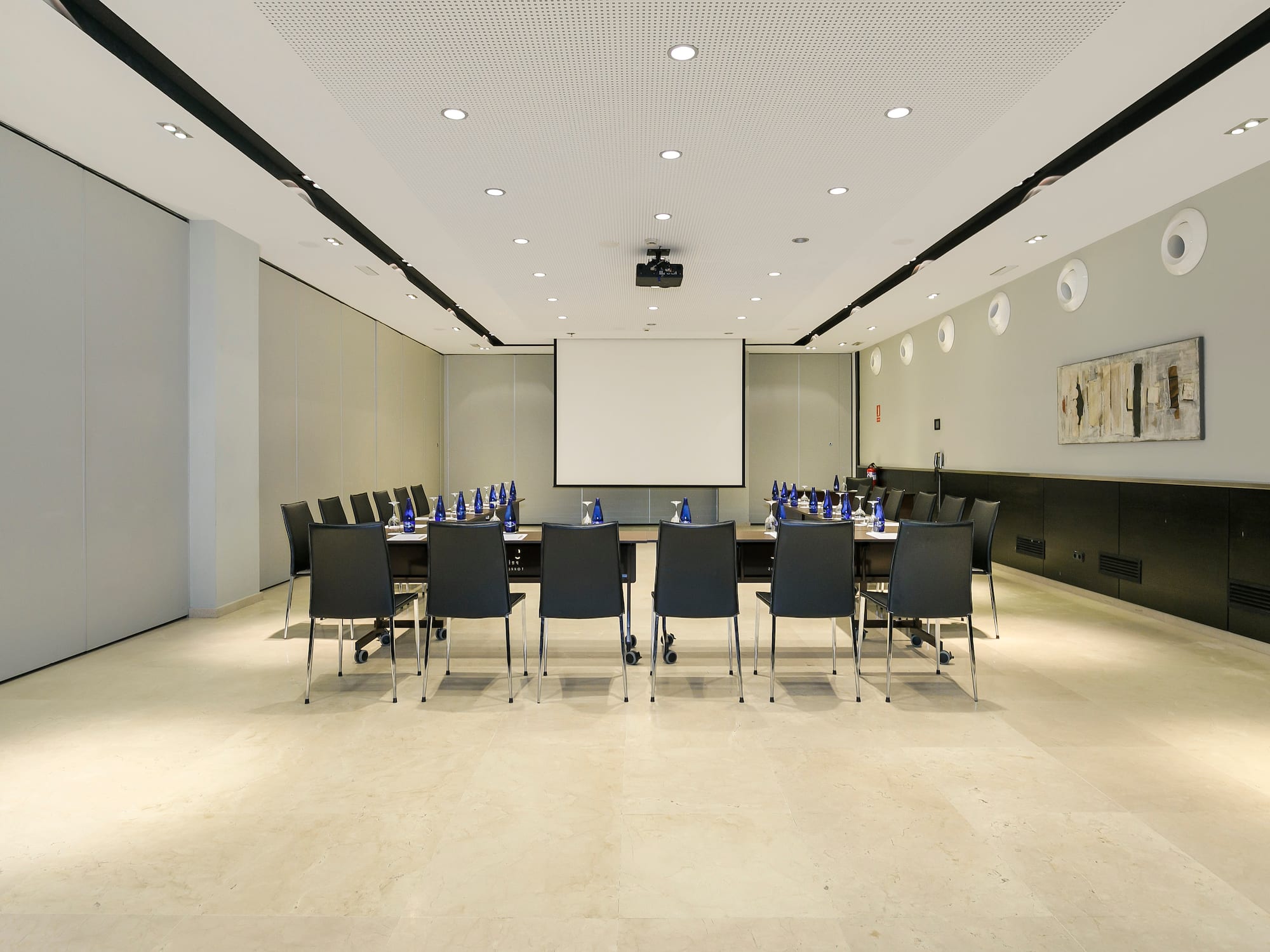 a conference room with a table and chairs