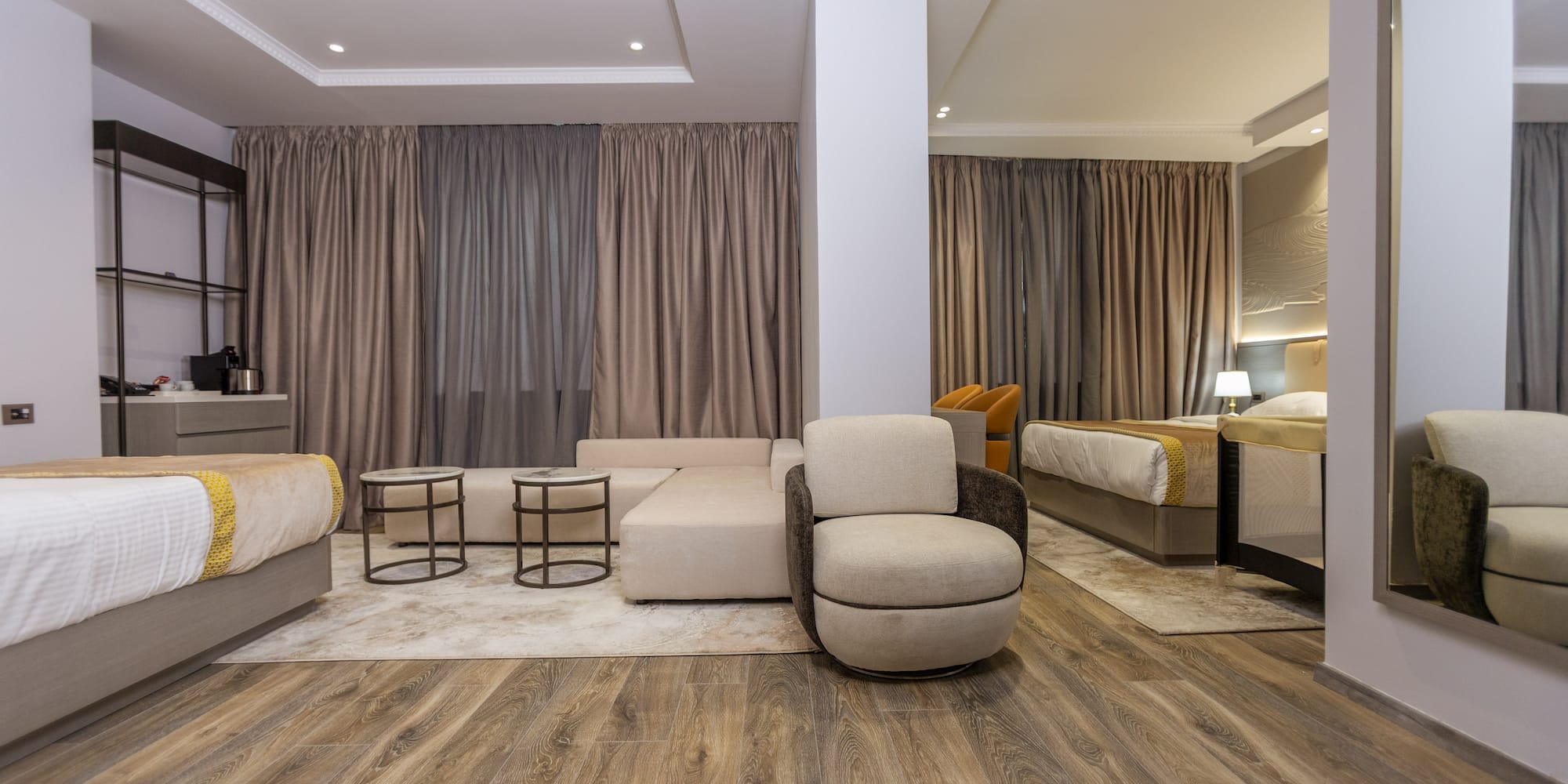 a room with a couch and beds