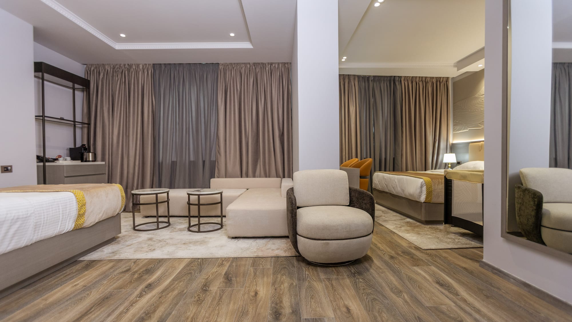 a room with a couch and beds