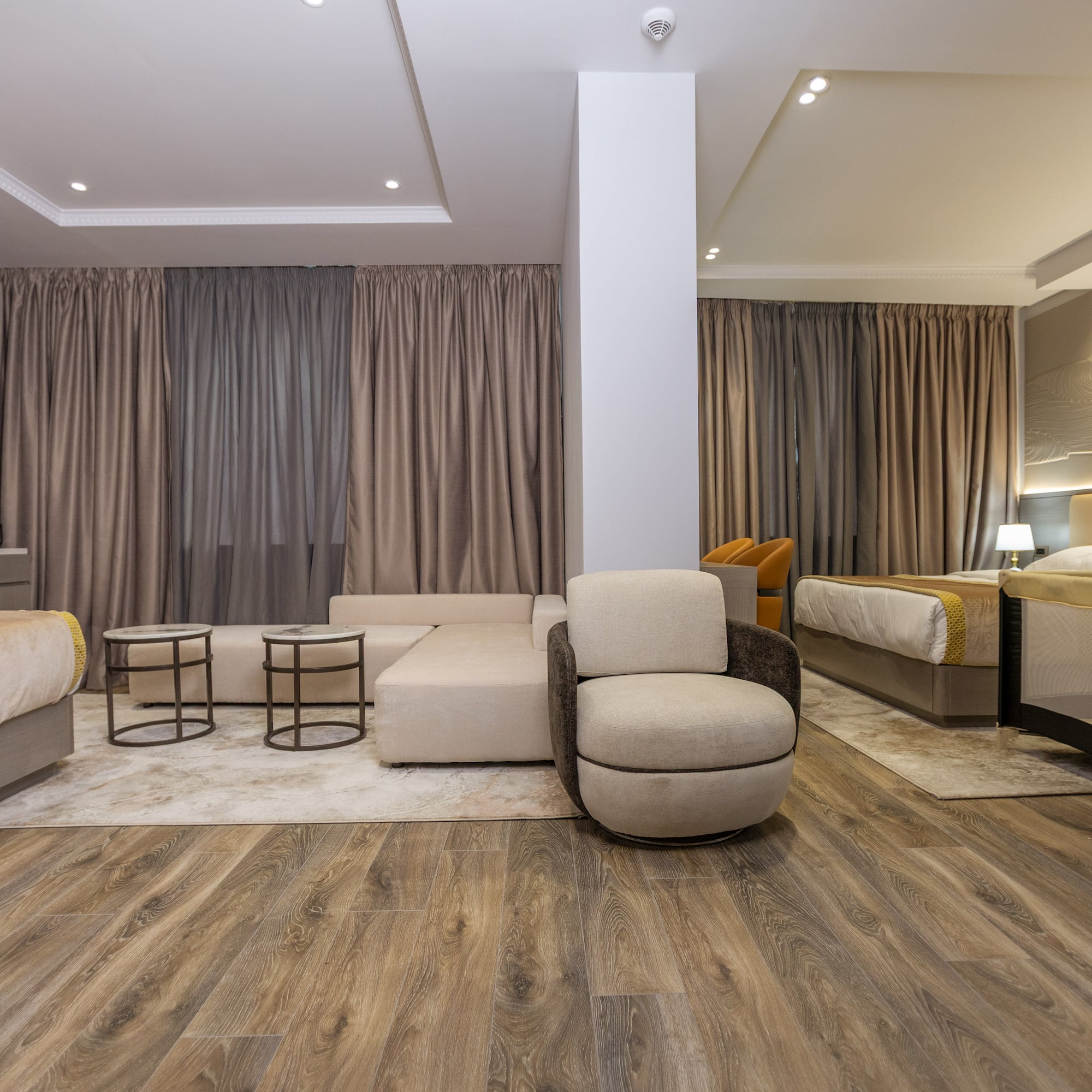 a room with a couch and beds