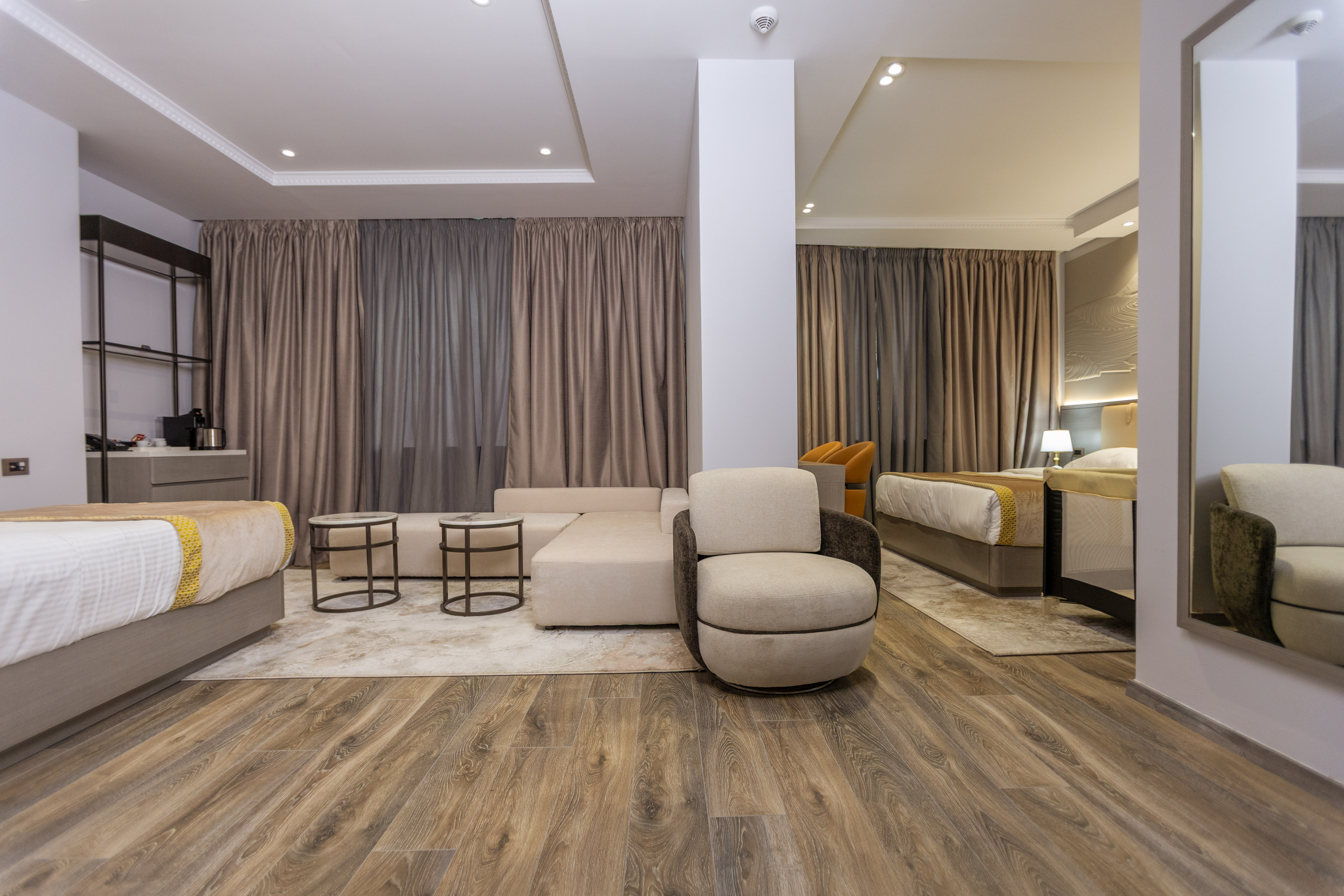 a room with a couch and beds