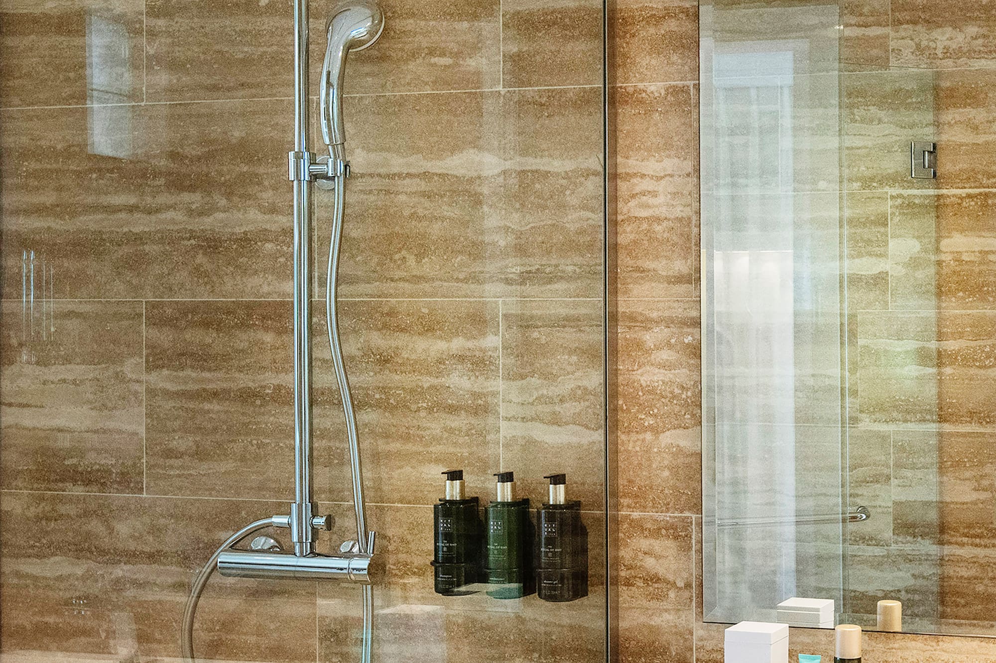a bathroom with a shower and sink