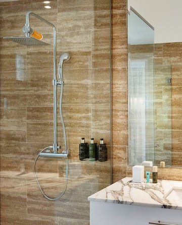 a bathroom with a shower and sink