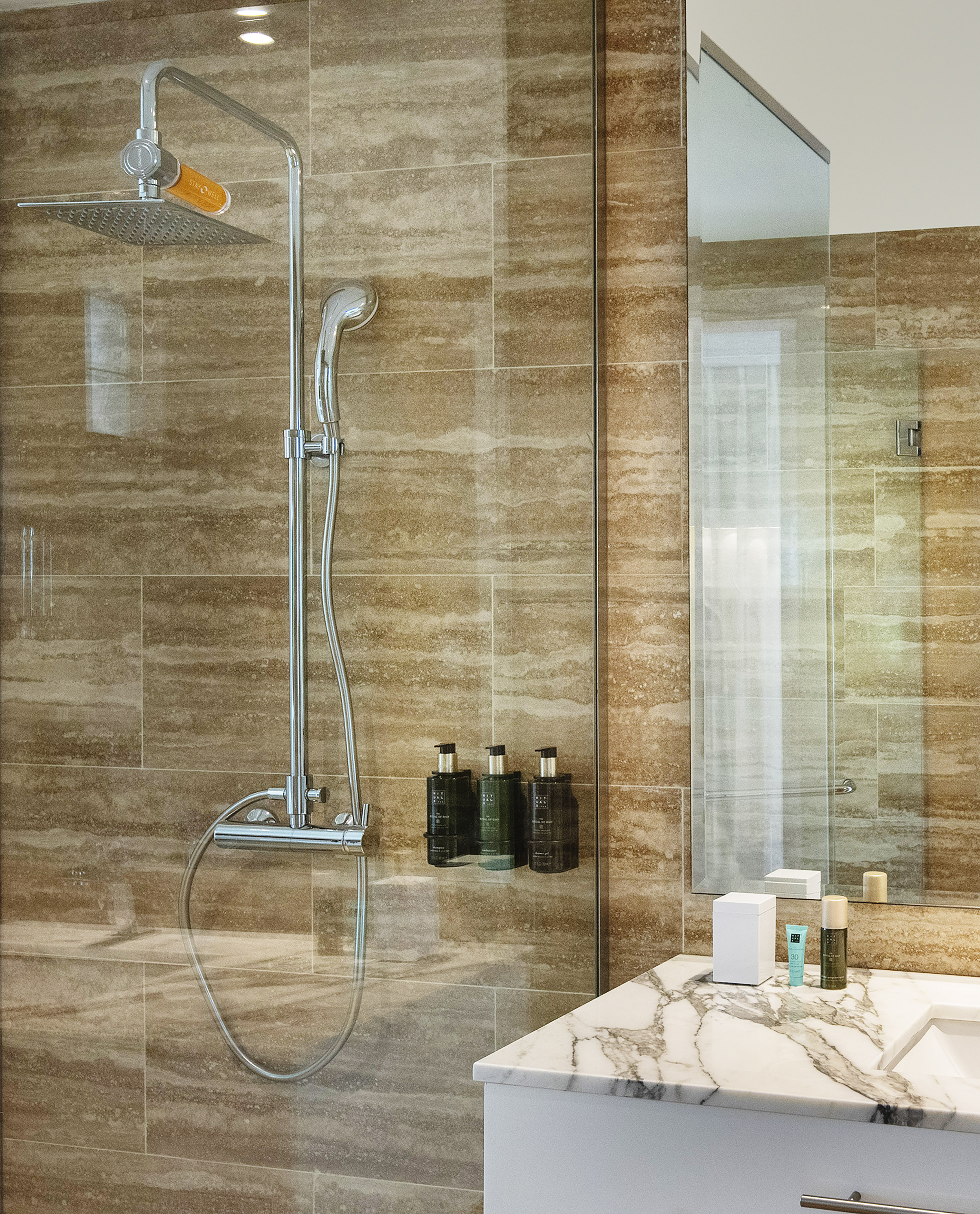 a bathroom with a shower and sink