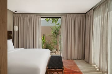 a bed in a room with curtains