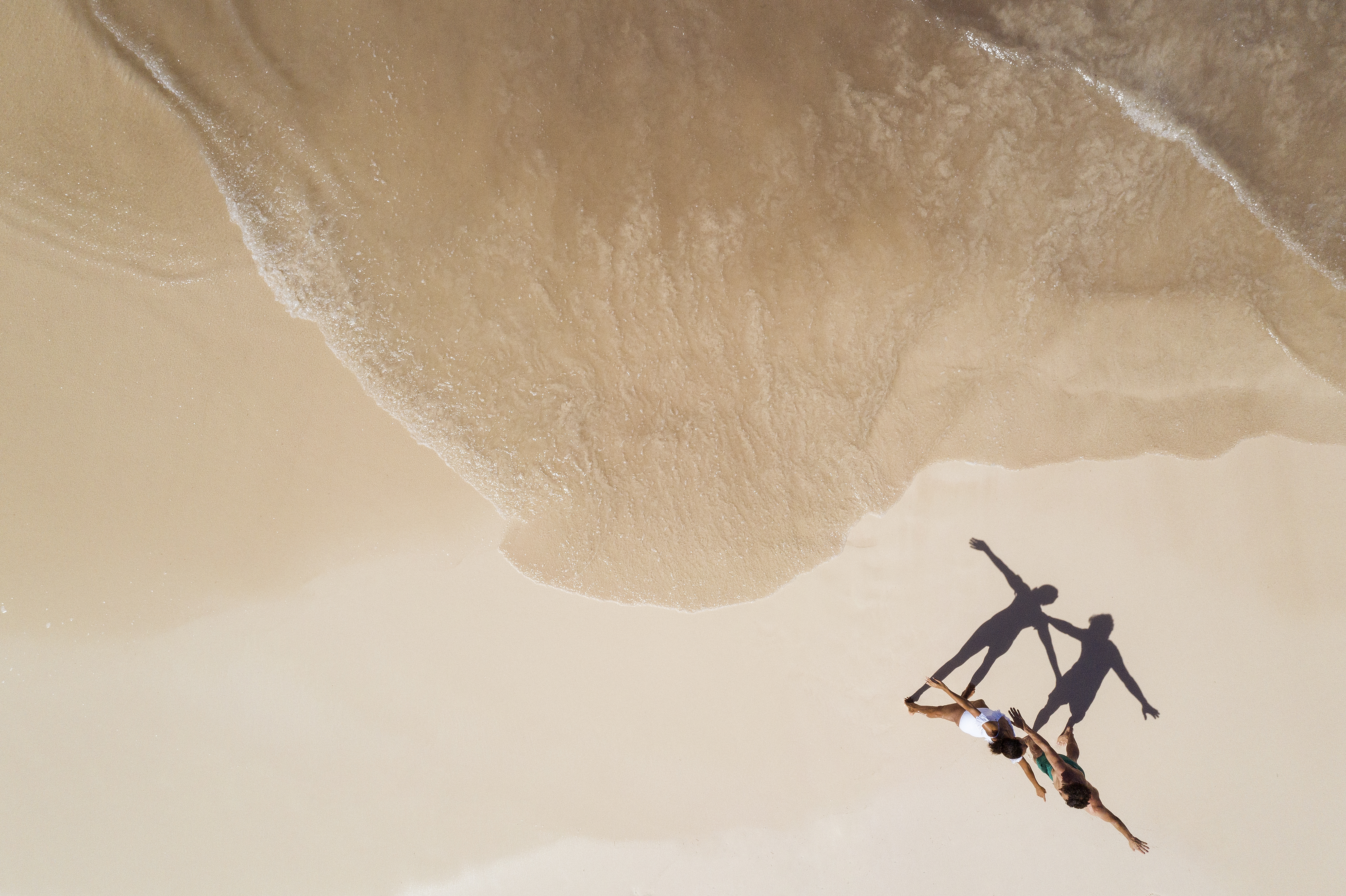 a group of people on a beach