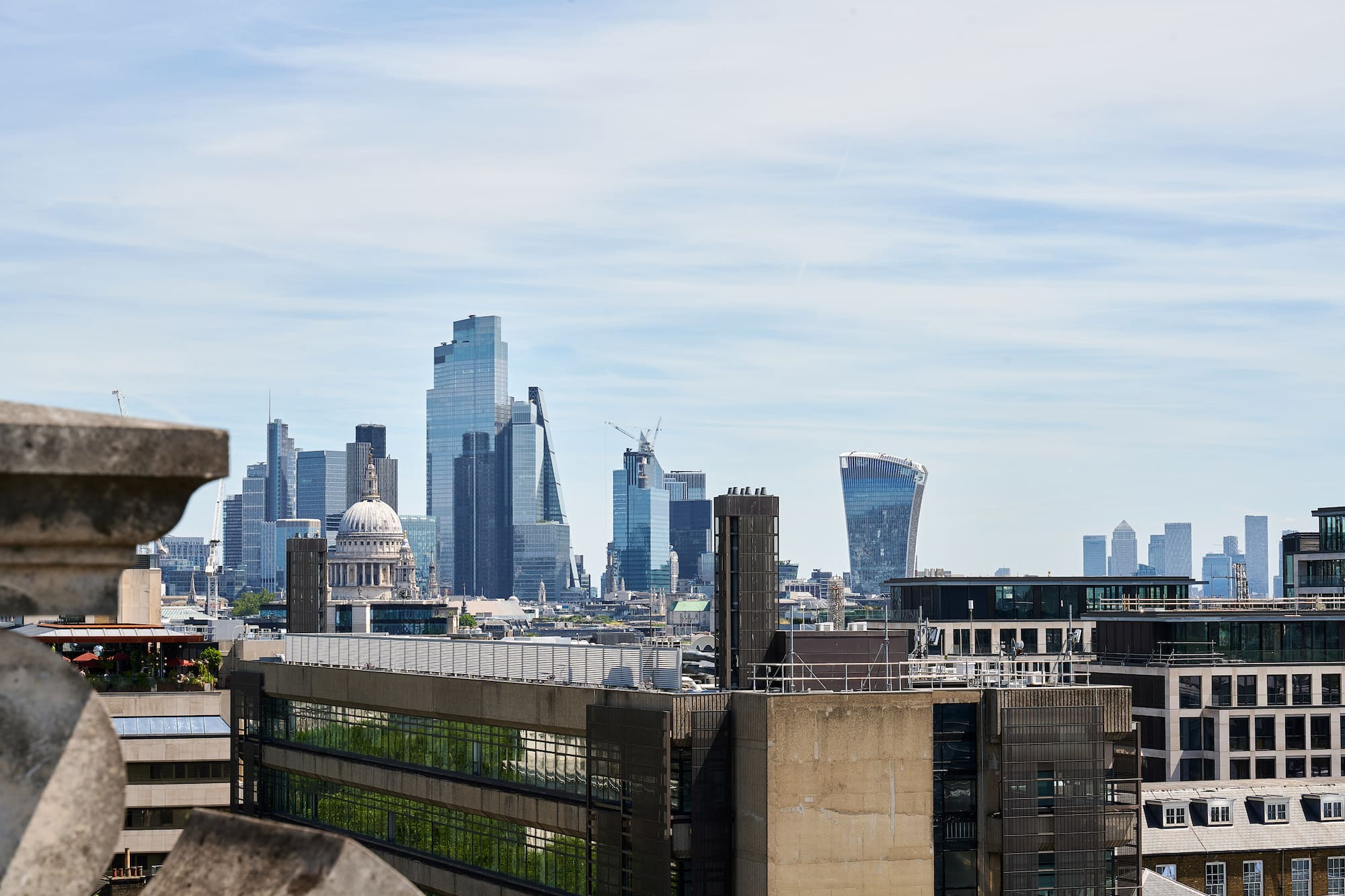 a city skyline with a building in the background