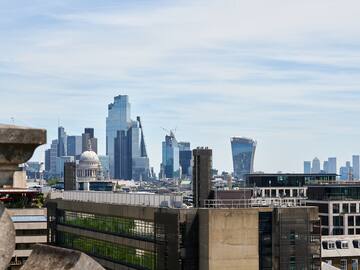 a city skyline with a building in the background