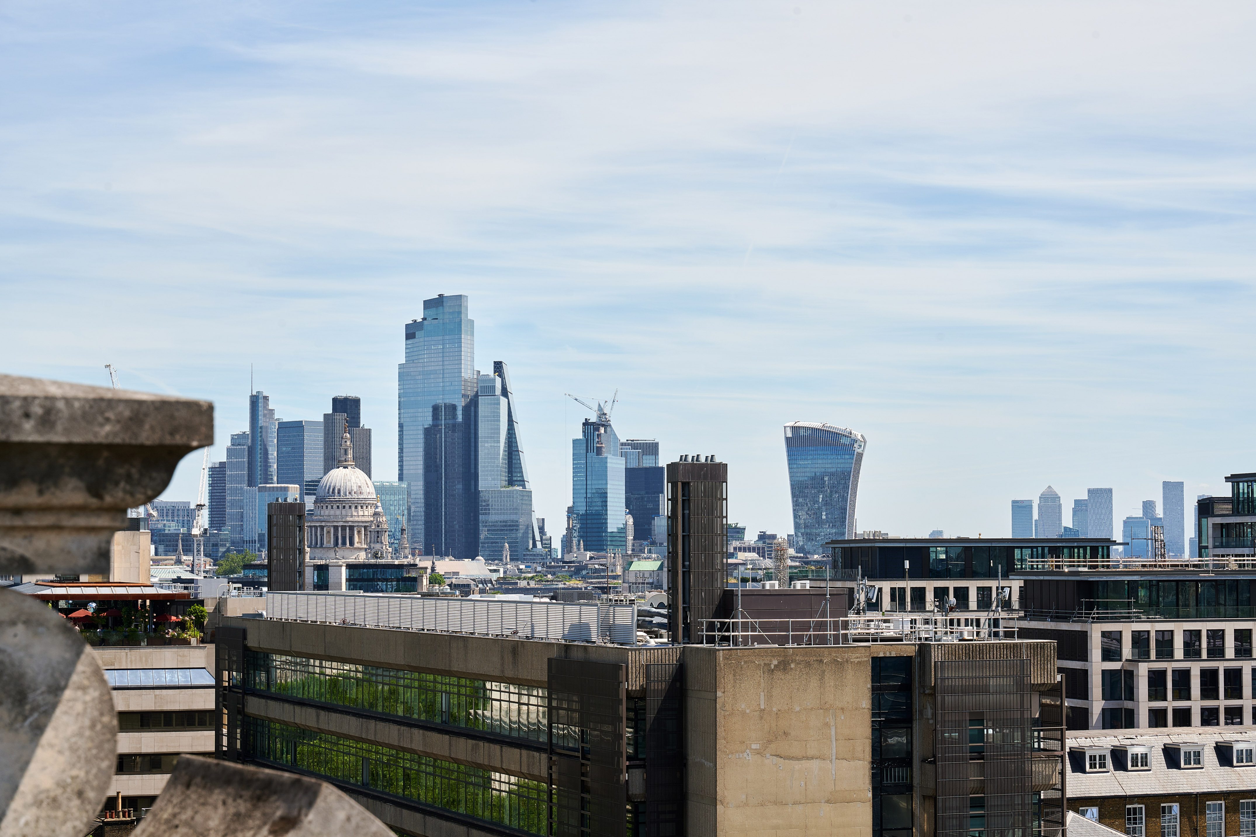 a city skyline with a building in the background