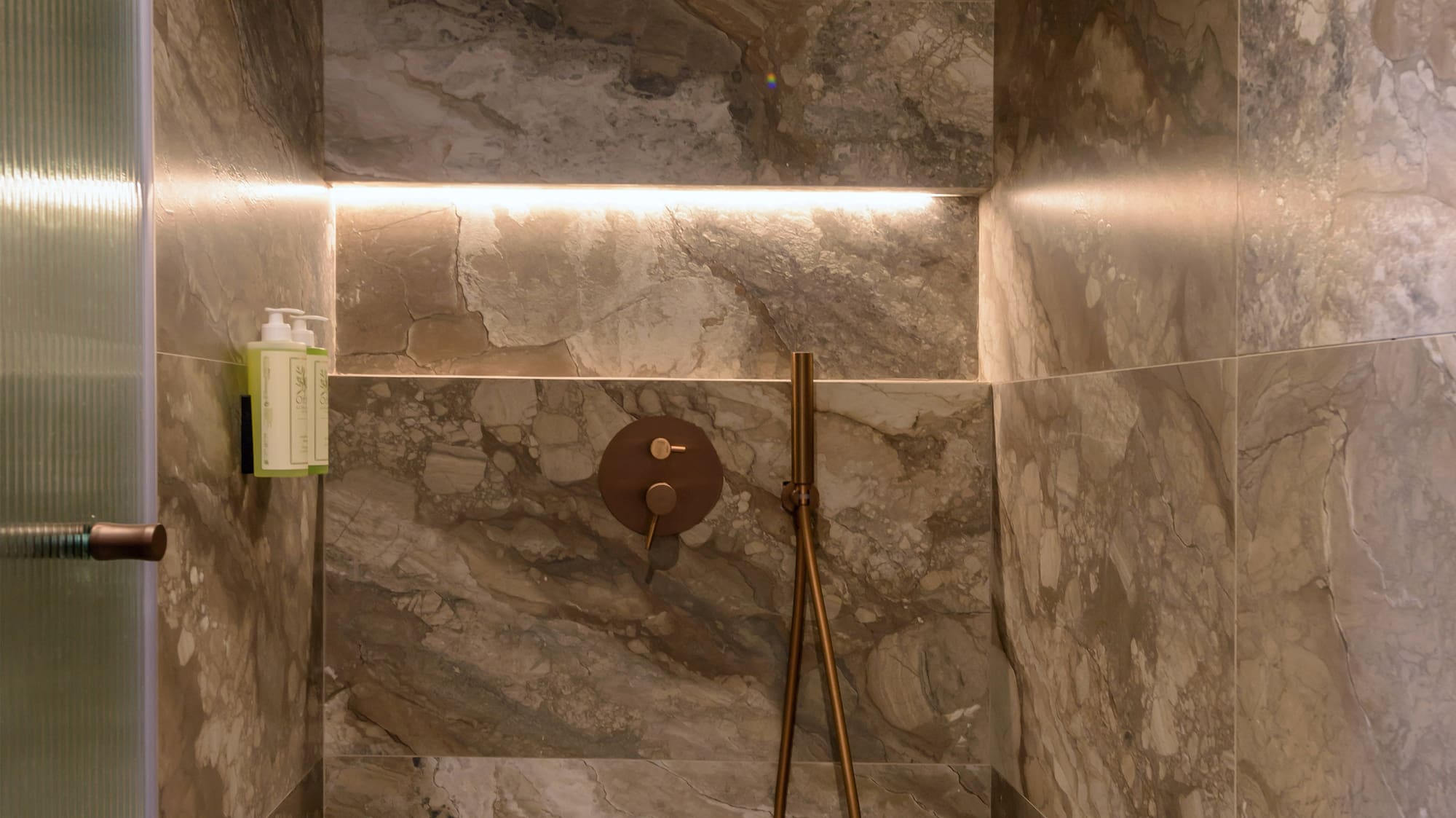 a shower with a shower head.