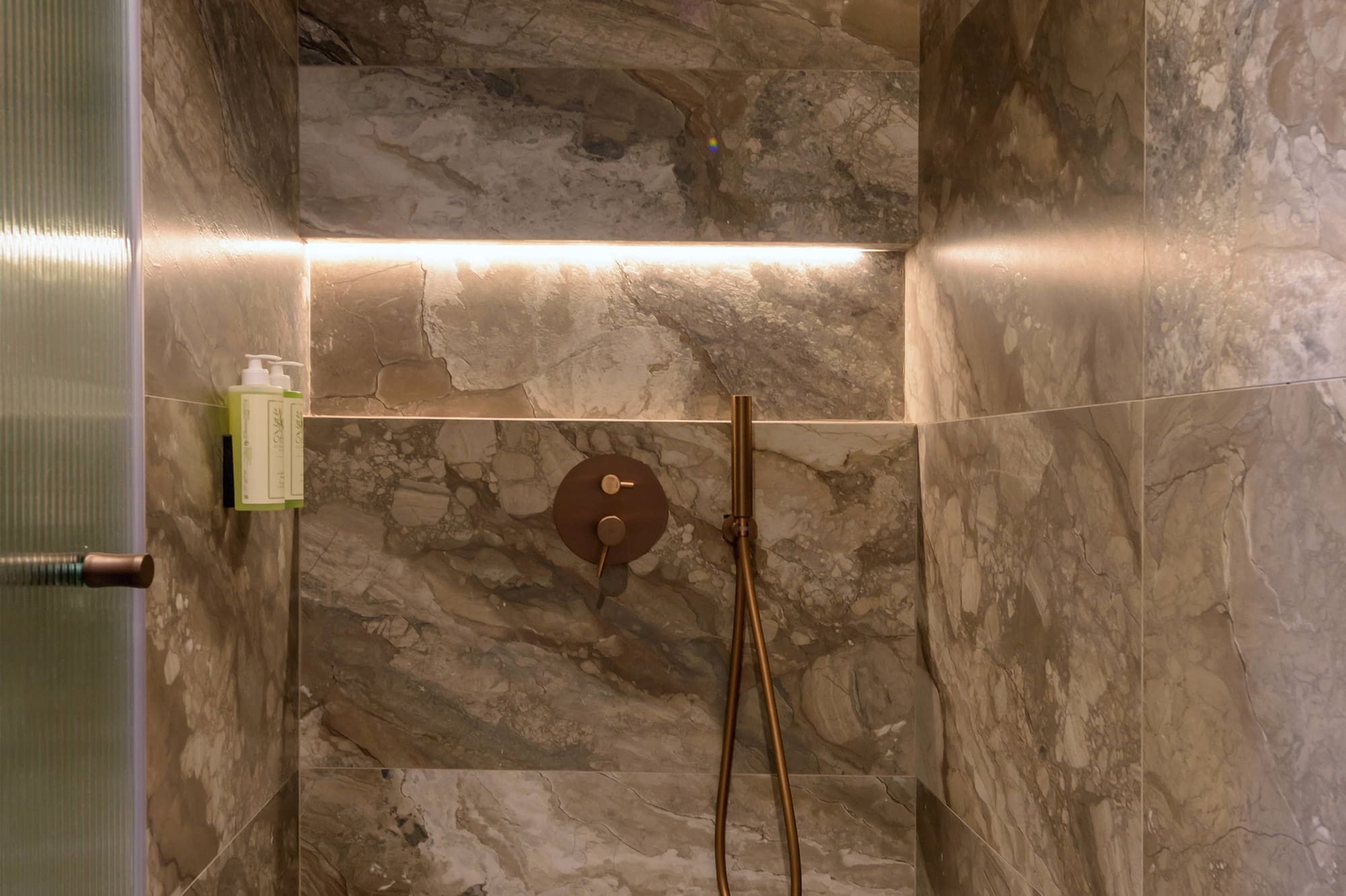 a shower with a shower head.