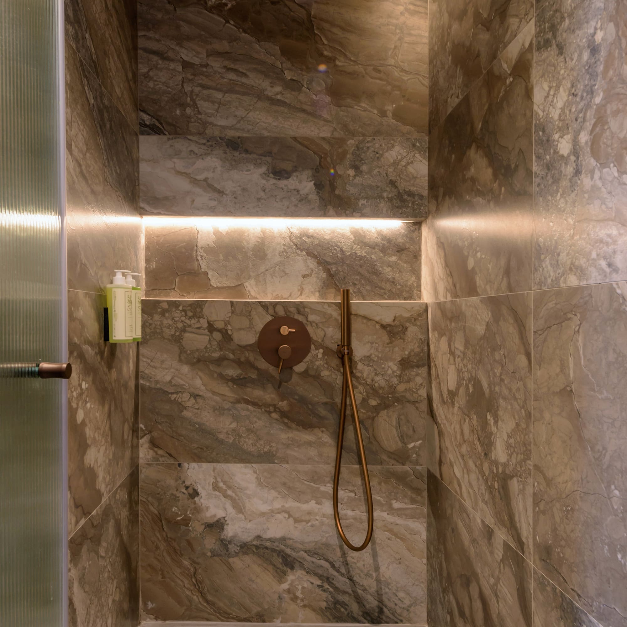 a shower with a shower head.