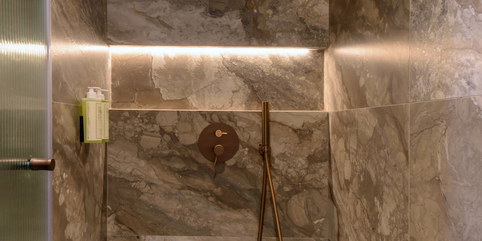 a shower with a shower head.