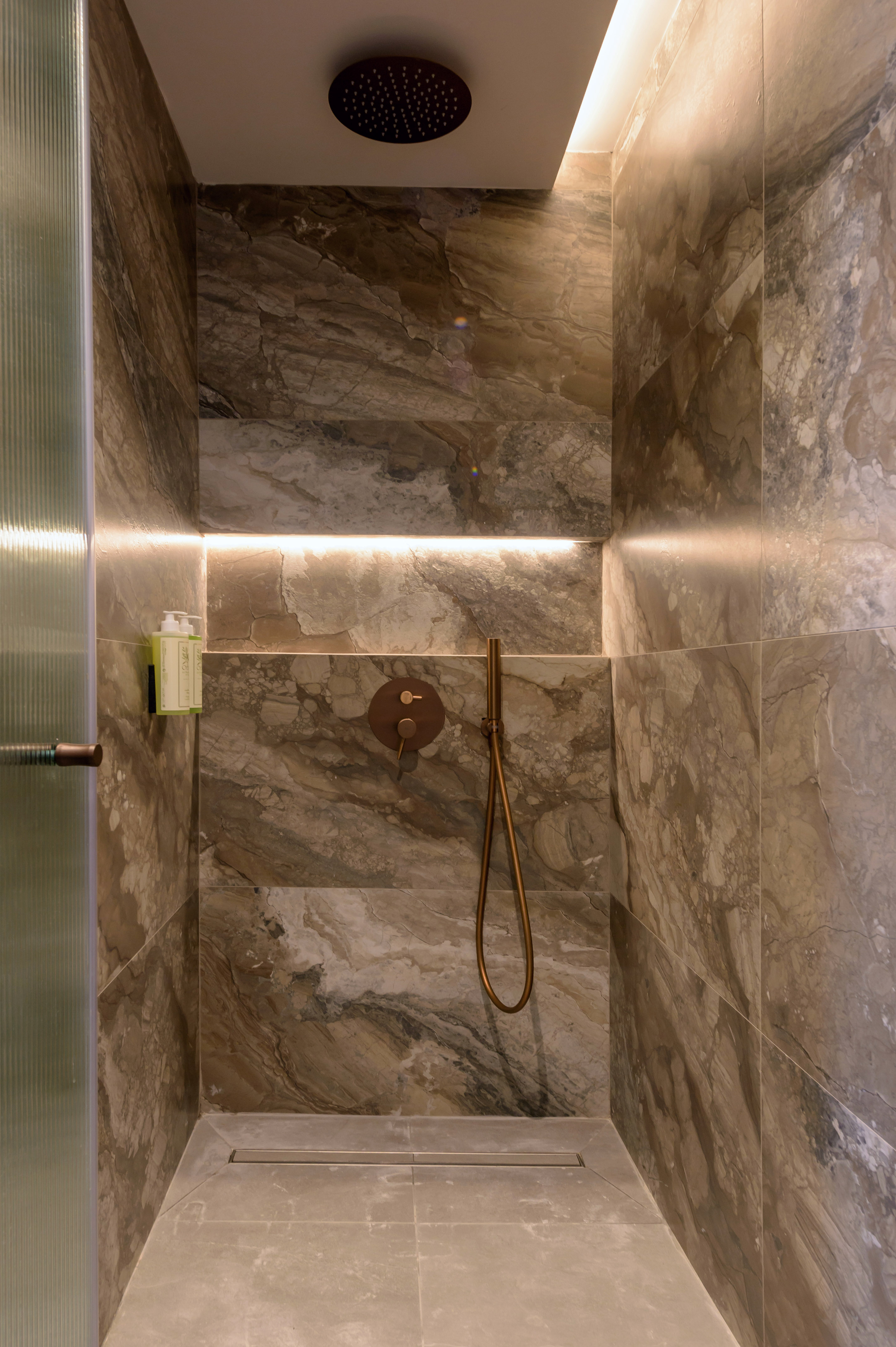 a shower with a shower head.