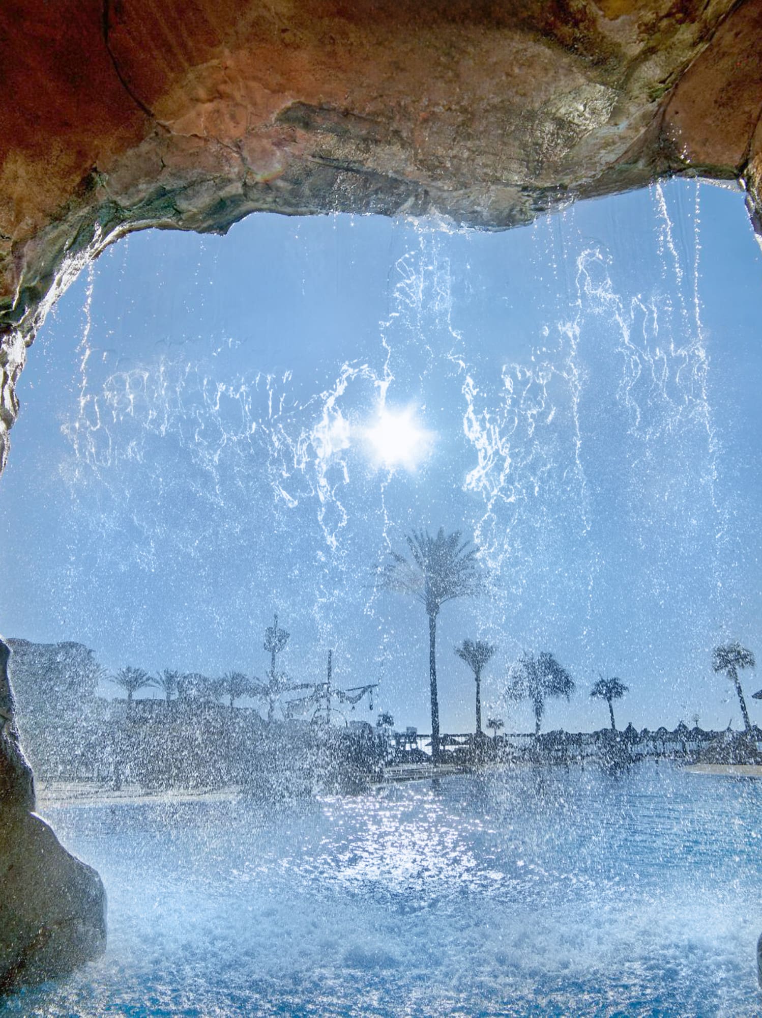 a water falling from a cave