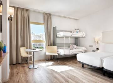 a room with a bunk bed and a table