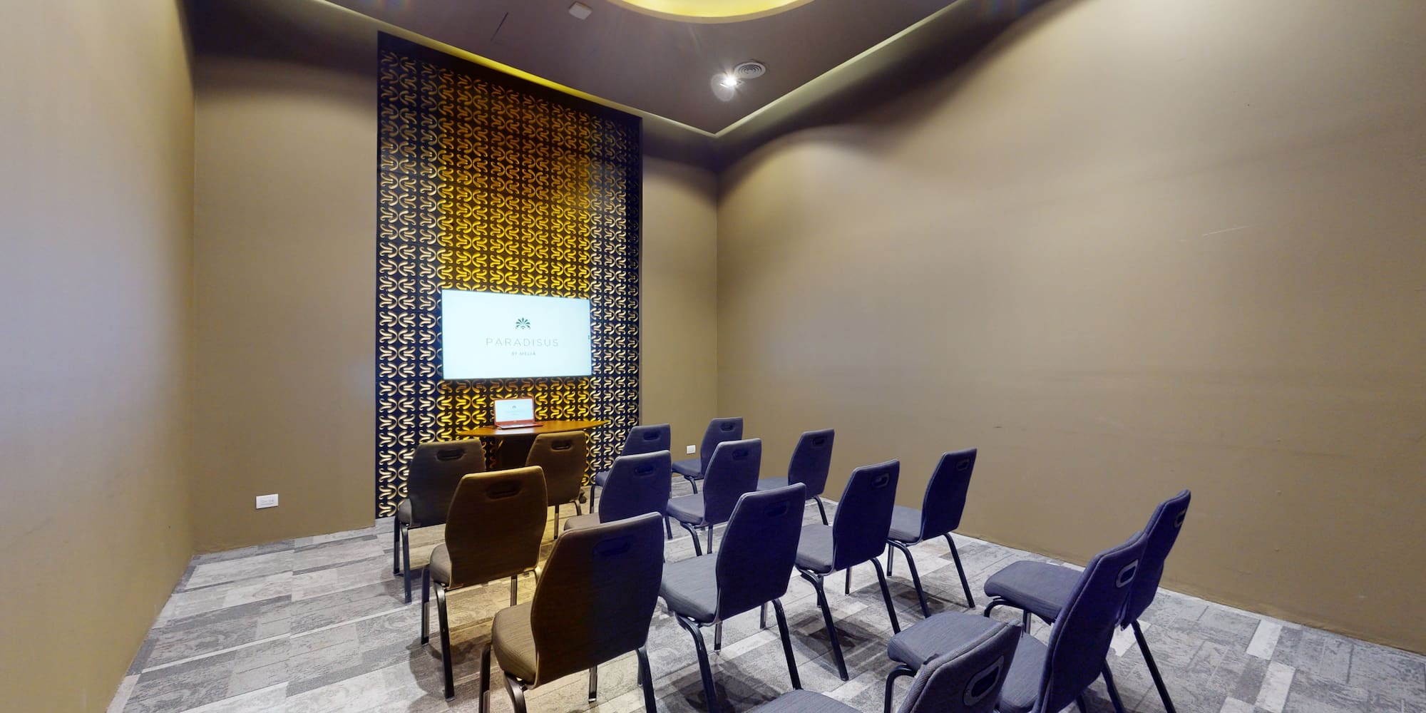 a room with chairs and a screen