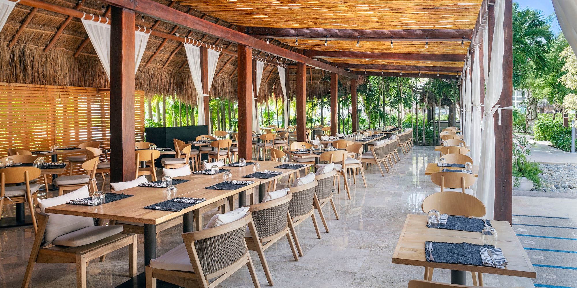 a restaurant with tables and chairs