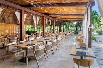 a restaurant with tables and chairs