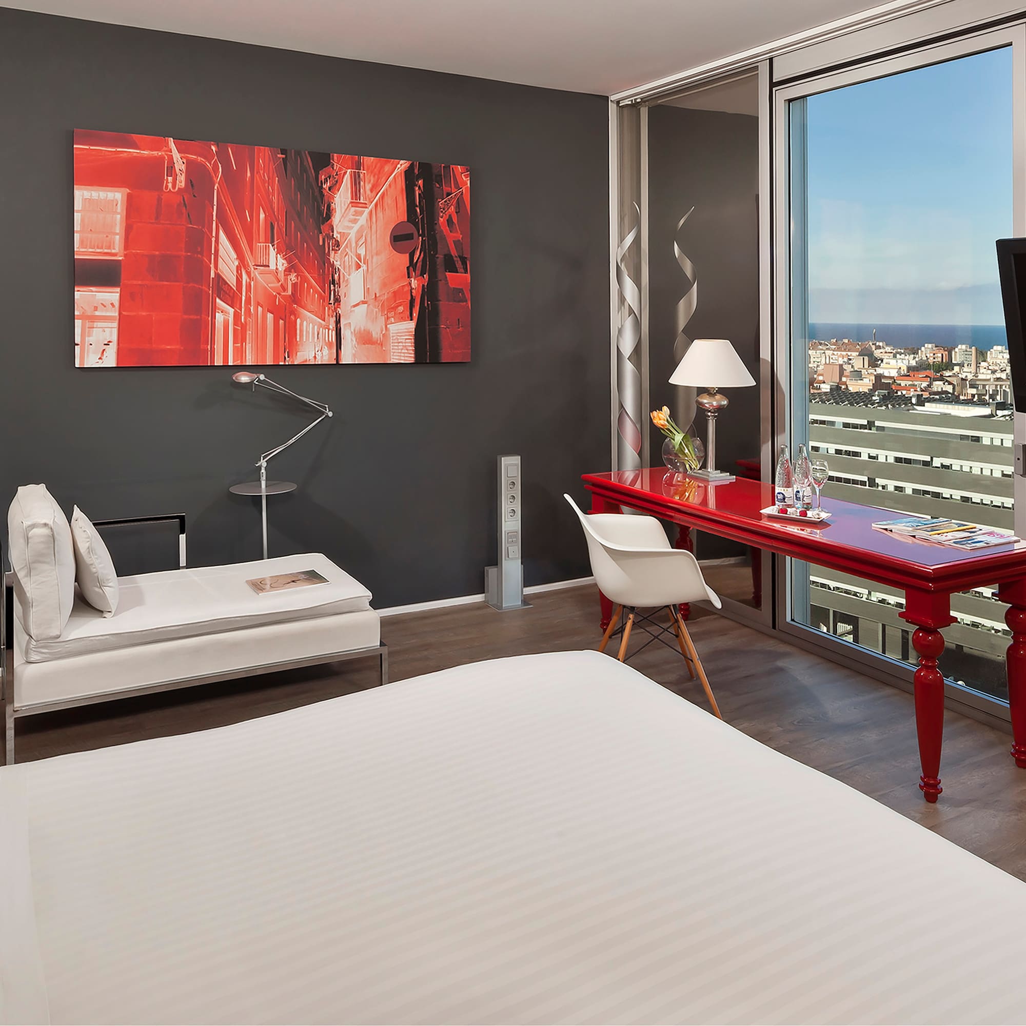 a room with a red desk and a red table