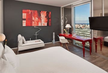 a room with a red desk and a red table