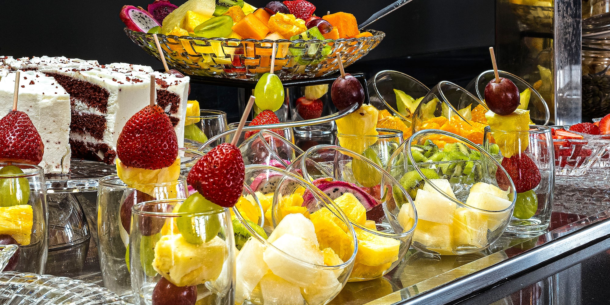 a table with fruit in glasses