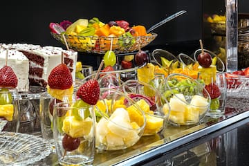 a table with fruit in glasses