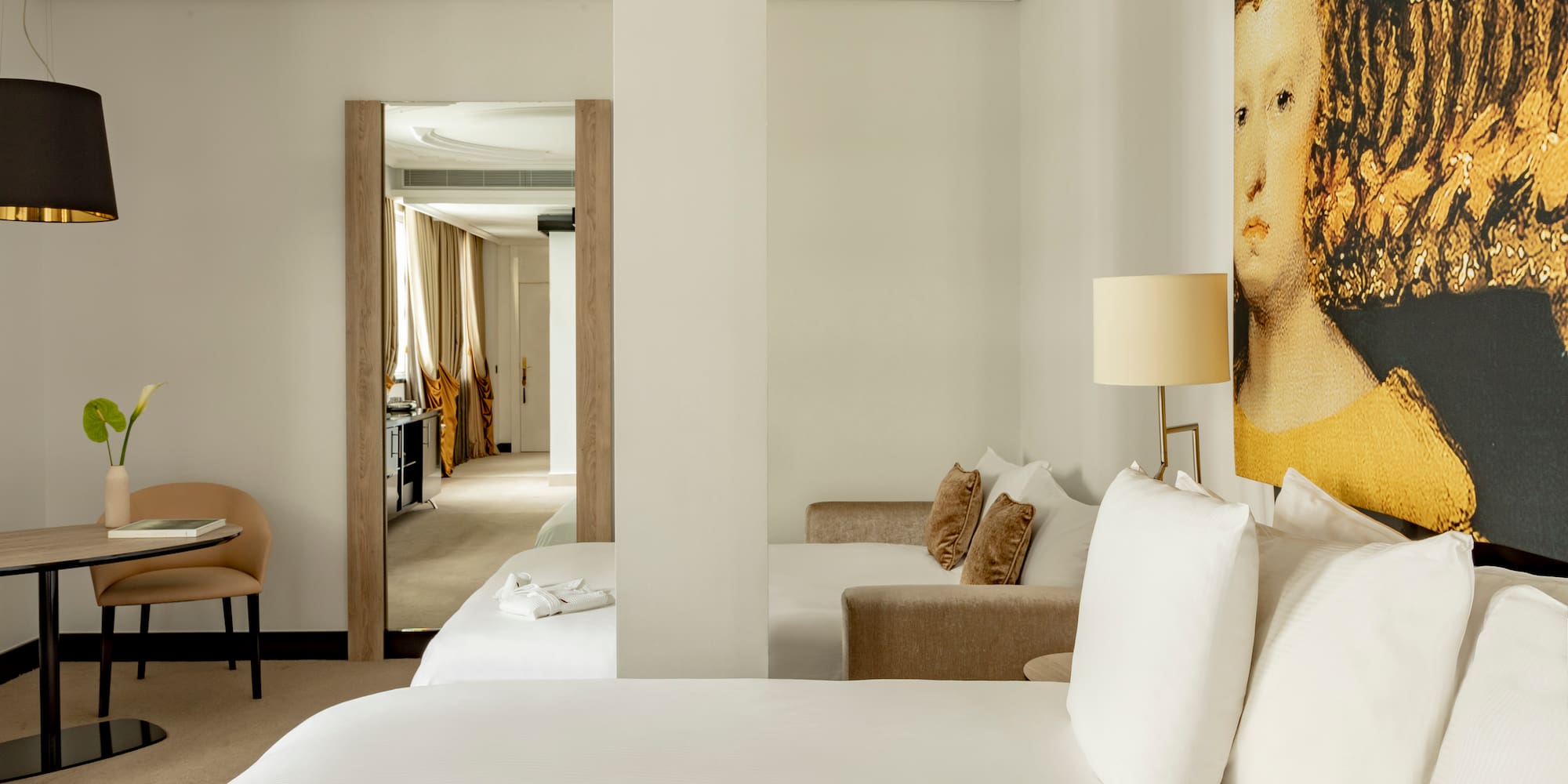 a room with a bed and a lamp