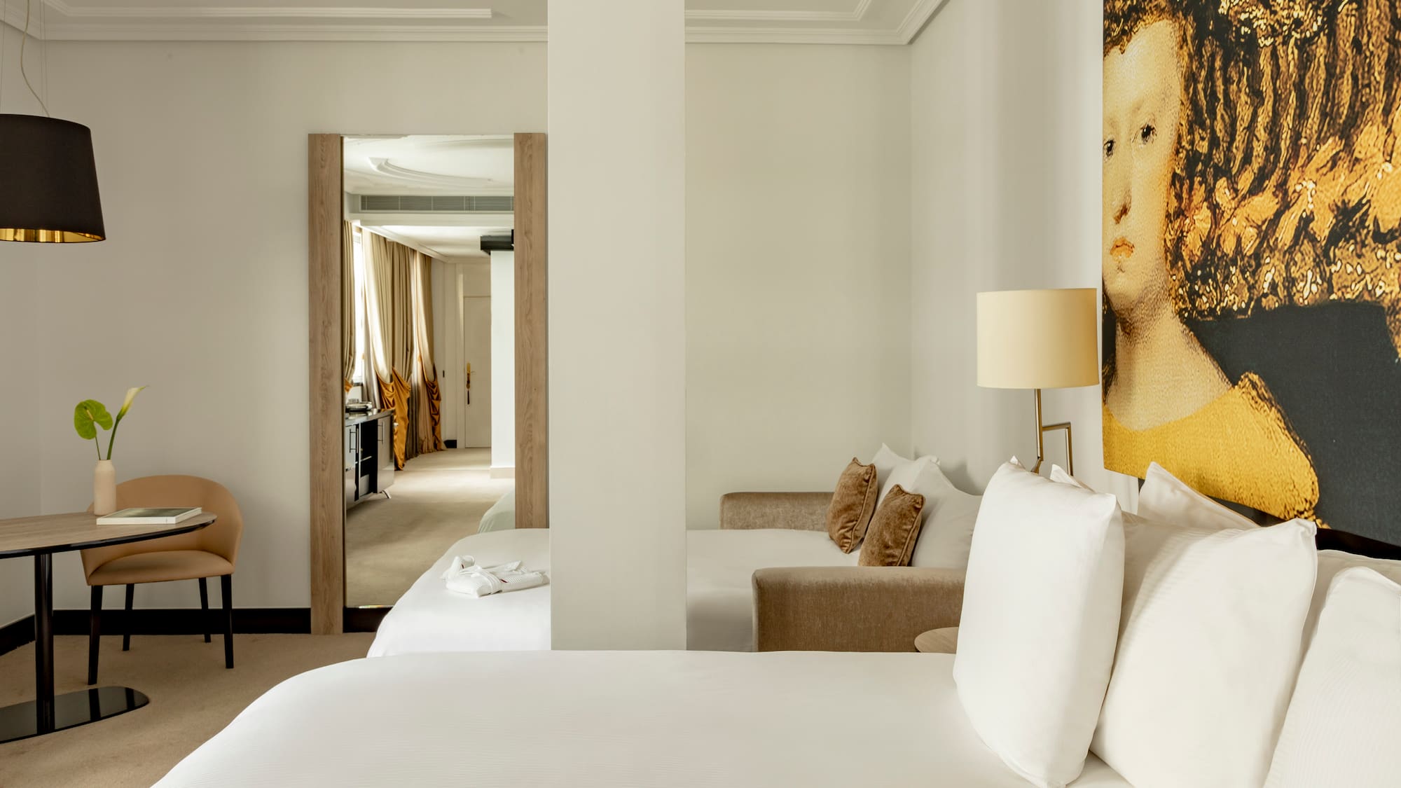 a room with a bed and a lamp