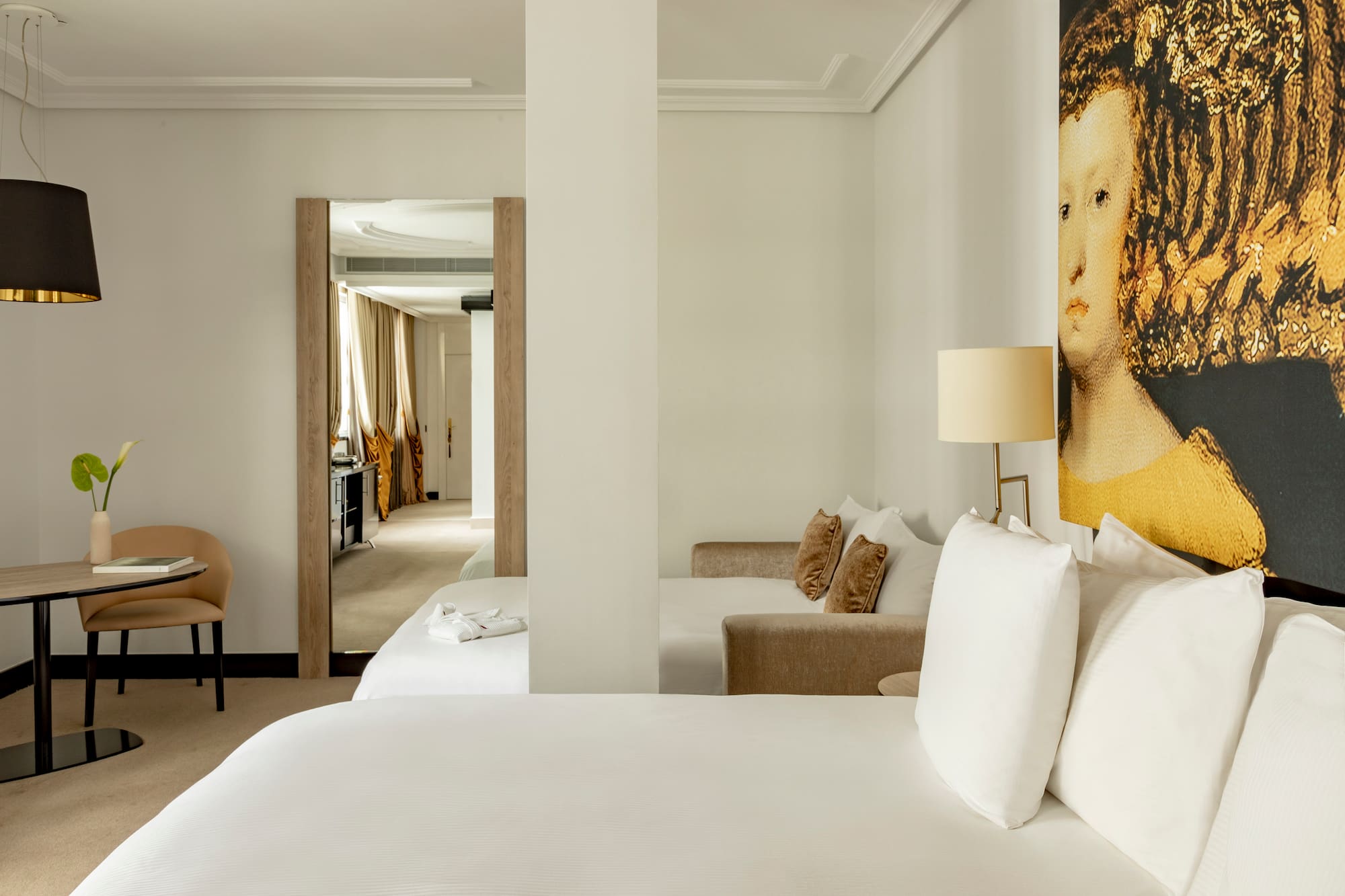 a room with a bed and a lamp