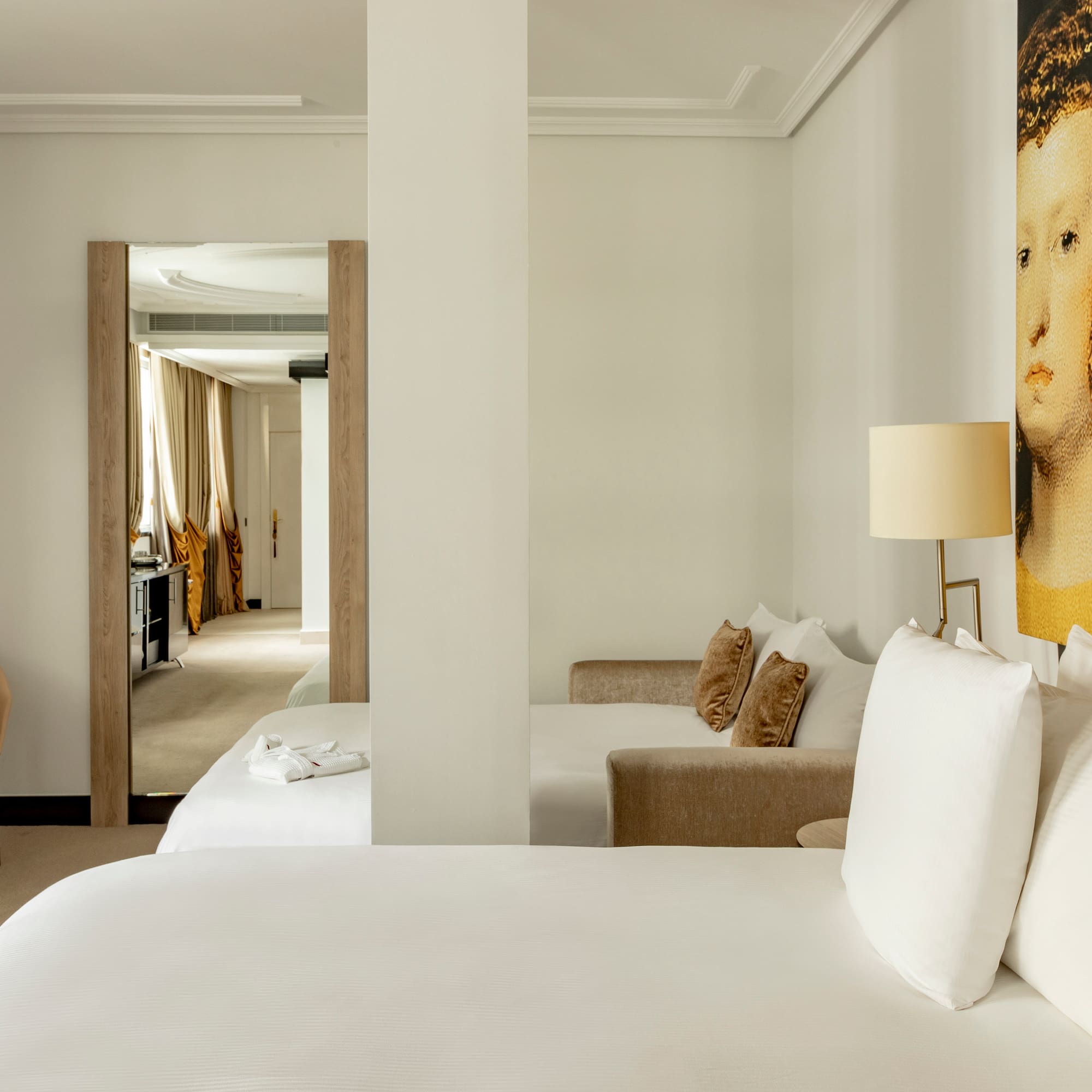 a room with a bed and a lamp