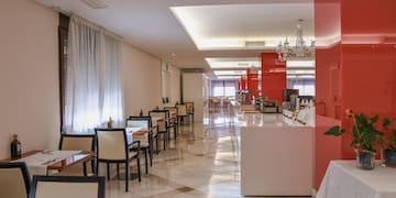 a room with tables and chairs