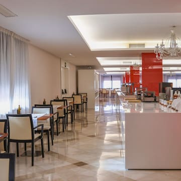 a room with tables and chairs