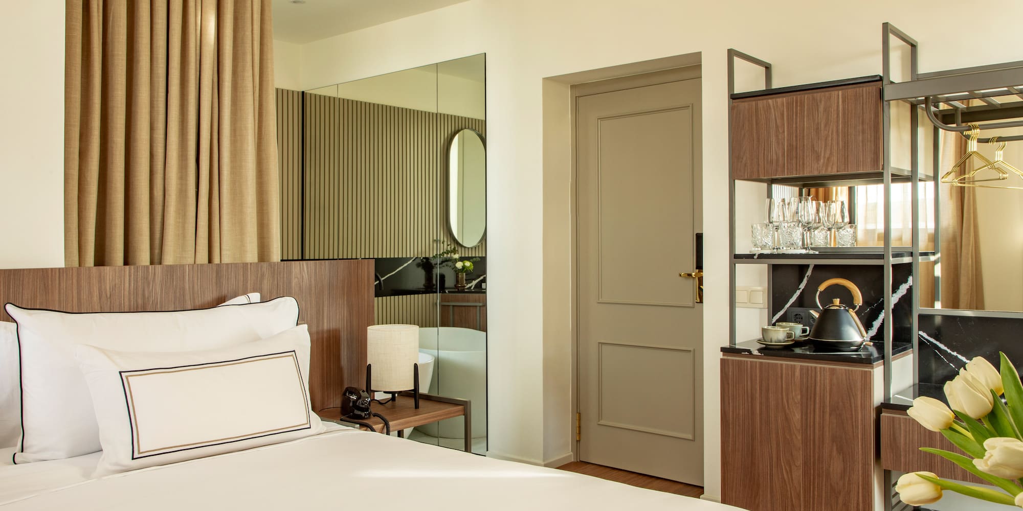 a room with a bed and a mirror