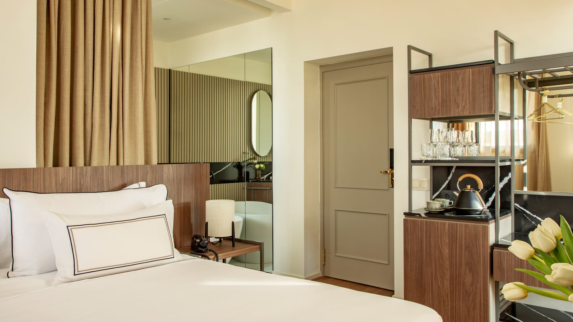 a room with a bed and a mirror