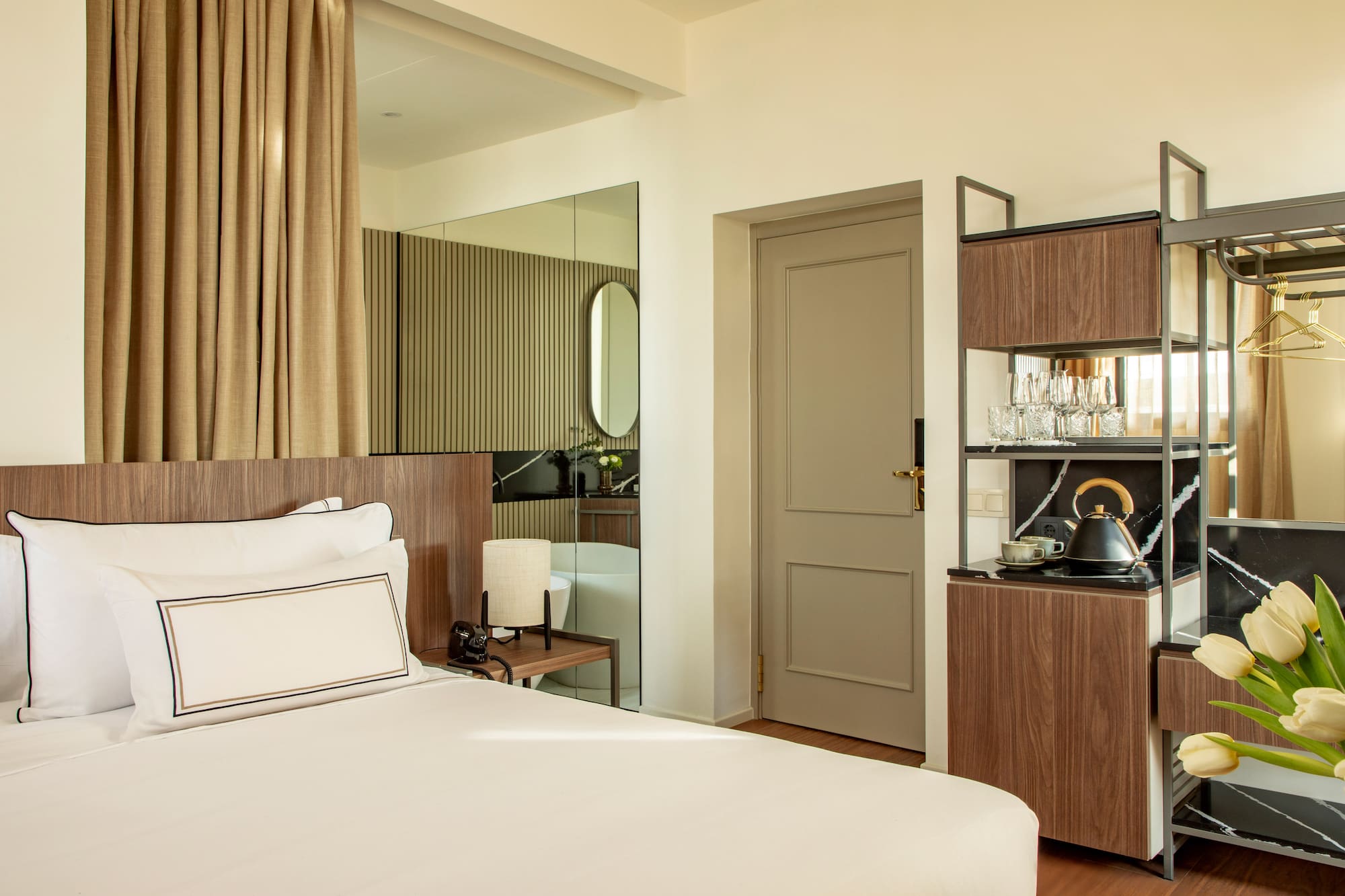 a room with a bed and a mirror